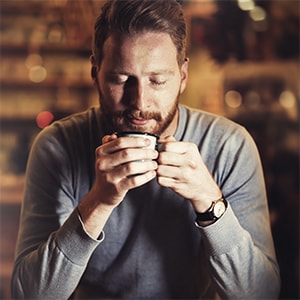 Man Savoring TRUBRU™ Coffee